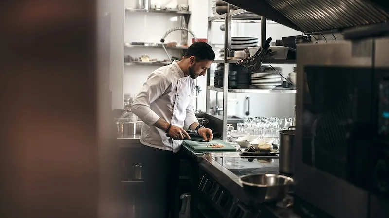 Chef preparing food in a commercial kitchen